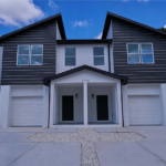 Plan 0112 by HeLo Homes – front exterior of the two-story duplex with two garages