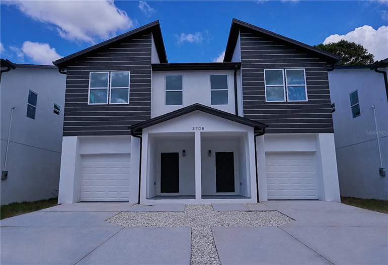 Plan 0112 by HeLo Homes – front exterior of the two-story duplex with two garages